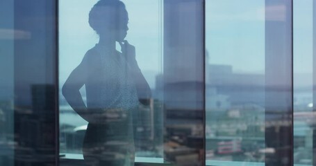 Business, woman and window with thinking of planning, idea or strategy for proposal or corporate decision. Professional, employee and reflection at workplace or office with thoughtful for analysis