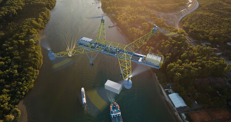 A large electric drone transports a sea container (shipping container). The near future. Flying over the river. Drone: 3D model, background: photo. 3d illustration.
