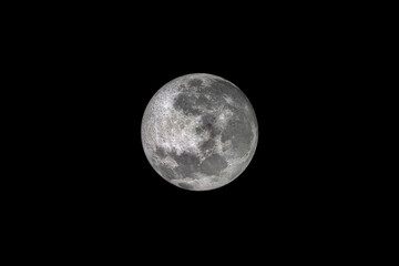 Detailed image of the enlargement of the full moon, with the background of a clear night sky...