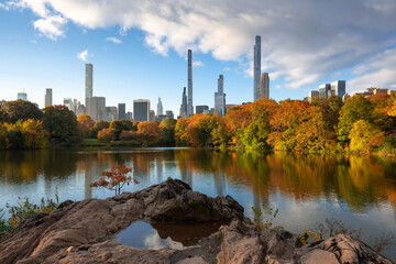 The Lake in Central Park West Historic District with Billionaires' Row skyscrapers. Autumn on Upper West Side, Manhattan, New York City