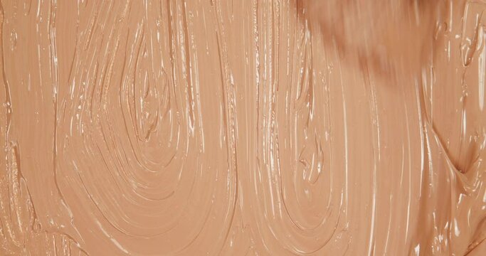 Liquid Foundation Background. Makeup Concept. BB Cream Strokes, Smears. Liquid Powder Backdrop. Cosmetics Texture with Paint Brush