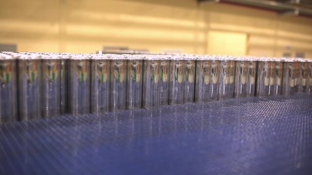 Conveyor line with the production of aluminum cans. Production of aluminum cans for drinks. Plant of high-tech equipment for the food industry.
