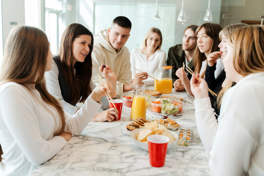 Group Of Friends Talking Together, Celebrating Birthday Party At Home