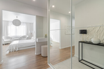 Fototapeta na wymiar Minimalist hallway with modern interior design in contemporary apartment.