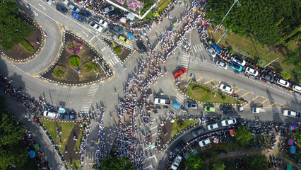 A bird's-eye view of people marching The tradition of eating precepts and eating vegetables in...