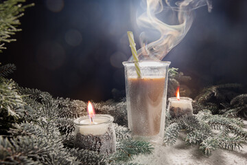 hot chocolate in a mug among candles