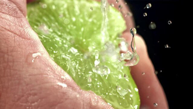 Splash of lime juice. Filmed on a high-speed camera at 1000 fps. High quality FullHD footage