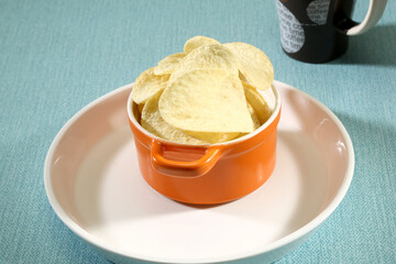 Patato Chips in a Orange bowl