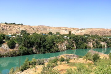 Beautiful mountain landscape on sunny day. Turquoise water of Naryn river in the mountains not far...