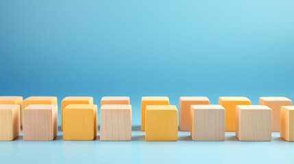 Diversity, individuality or difference concept. Selective focus wooden cubes with yellow color at the center isolated on blue background. - obrazy, fototapety, plakaty