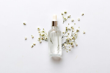 Fancy healthcare bottles for serum, micellar, tonic, toner, lotion, water and cream with gypsophila...