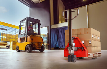 Modern warehouse. Pallet jack with boxes. Forklift for transporting goods. Storage equipment. Industrial hangar with trolleys. Equipment for cargo transportation. Warehouse inside with open gate - obrazy, fototapety, plakaty