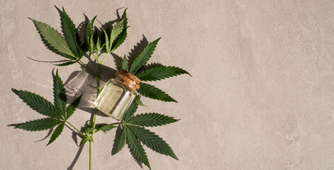 CBD oil hemp products. glass bottle with CBD oil, hemp leaves. Medicinal cannabis with extract oil. Cosmetics CBD oil