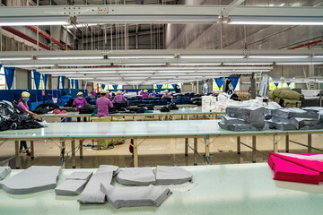 Industrial cloth cutting machine and fabric cutting area in garment factory in industrial zone in...