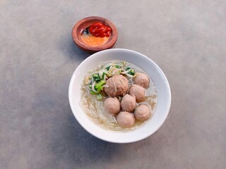 stew with vegetables. bakso or Indonesian meatball soup with noodles. soup filled with vermicelli, meatballs and vegetables.
