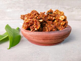 bowl of peanut sauce. solid peanut sauce. spicy and sweet chili sauce.
