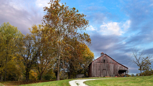 Autumn landscape with an old weathered barn