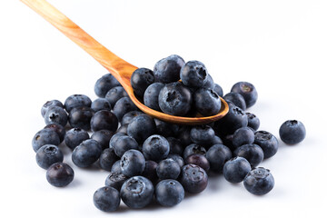 Fresh blueberries in wooden spoon