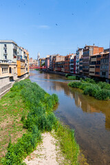 Fototapeta na wymiar Picturesque houses on the river in Girona, Spain