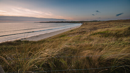 Fototapeta na wymiar Sunset over the Atlantic Ocean in western France. Long, quiet sandy beaches