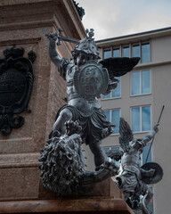 Putto created by Ferdinand Murmann at the corner of Mary's column in Marienplatz in Munich,...