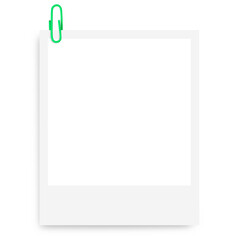 white Polaroid photo frame with a green paper clip on a blank background.