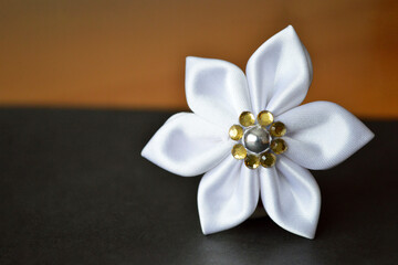 Handmade fabric flower. Hobby and craft concept.