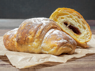 Homemade croissants on craft-paper, close-up