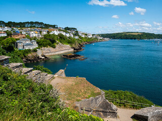 Looking over the estuary of the River Fowey, from the ruins of the 16th century St Catherine's Castle at Fowey on the south coast of Cornwall, UK. Blue summer sky.