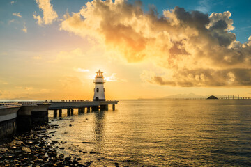 Fototapeta na wymiar Beautiful lighthouse scenery at sunrise by the sea, Zhuhai, Guangdong Province, China.
