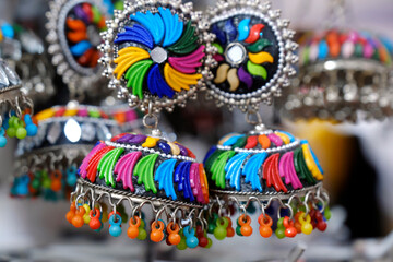 colorful traditional indian jewelry displayed in a street shop for sale in Pune, Maharashtra. Indian art, Indian artificial jewelry.