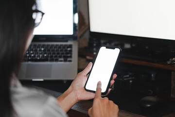 Mockup image of woman's hands holding black mobile phone with blank screen