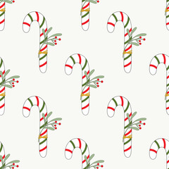 Seamless pattern of doddle Christmas candy canes on isolated background. Design for Christmas home decor, holiday greetings, Christmas and New Year celebration. 