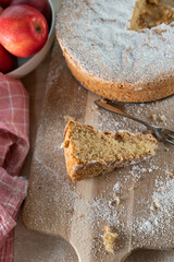 Slice of gluten free almond cake on wooden table