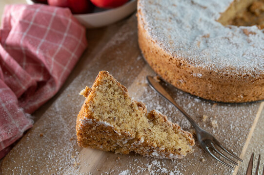 Gluten free fluffy sponge cake with almonds and powdered sugar topping