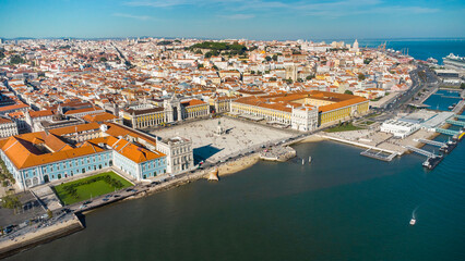 Aerial drone point of view of Commercio Square, Downtown Lisbon, Portugal. Panoramic view of cold city center. Travel destination visited annually by many foreigner tourists.  - obrazy, fototapety, plakaty