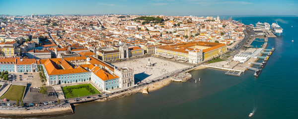 Aerial drone point of view of Commercio Square, Downtown Lisbon, Portugal. Panoramic view of cold city center. Travel destination visited annually by many foreigner tourists.  - obrazy, fototapety, plakaty