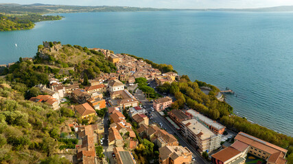 Fototapeta na wymiar Aerial view of the historic center of Trevignano Romano. It is a small town in the metropolitan city of Rome, Lazio, Italy. It is located on the volcanic Lake Bracciano.