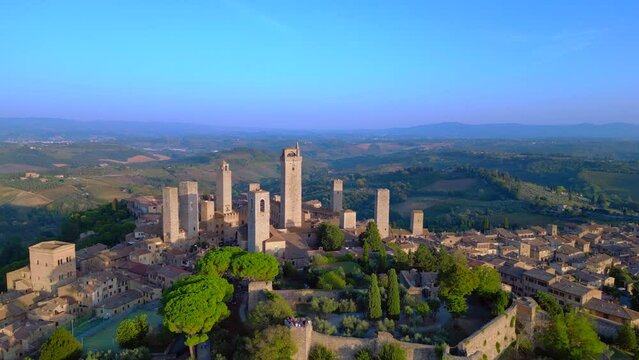 Wonderful aerial view flight drone San Gimignano hill Town sunset Tuscany Italy