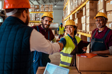 Warehouse Workers Greeting and Collaborating on Tasks