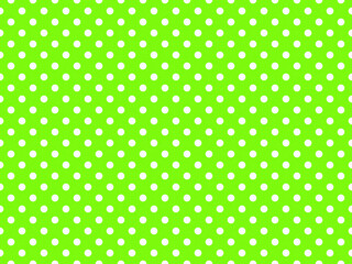 texturised white color polka dots over chartreuse green backgrou