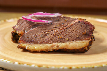 Beef steak close-up with onions. Concept of tasty food. Serving dishes in the restaurant