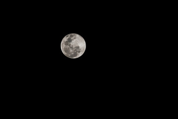 Close up full moon on the Black sky