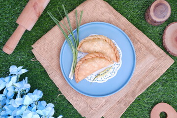 Curry puff (kari pap ) or Pastel Goreng is Pastry Popular in Indonesia.fried pastry with filling of...