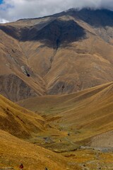Fototapeta premium Vertical shot of views near a mountain trail in the village of Juta, Georgia