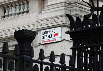 Downing Street sign on the wall of government building in Westminster, London, UK. 
