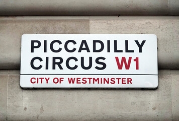 Piccadilly Circus sign on the wall of building in Westminster, London W1, England. 