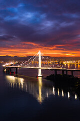 Fototapeta na wymiar SF Bay Bridge Eastern Span During Vibrant Sunrise 