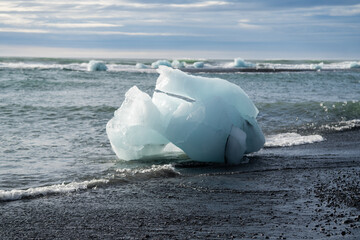 Blue piece of ice on the Diamond beach in Iceland