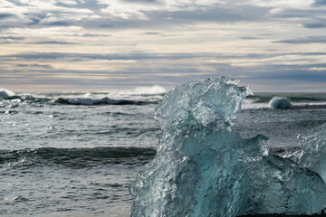 Blue piece of ice on the Diamond beach in Iceland